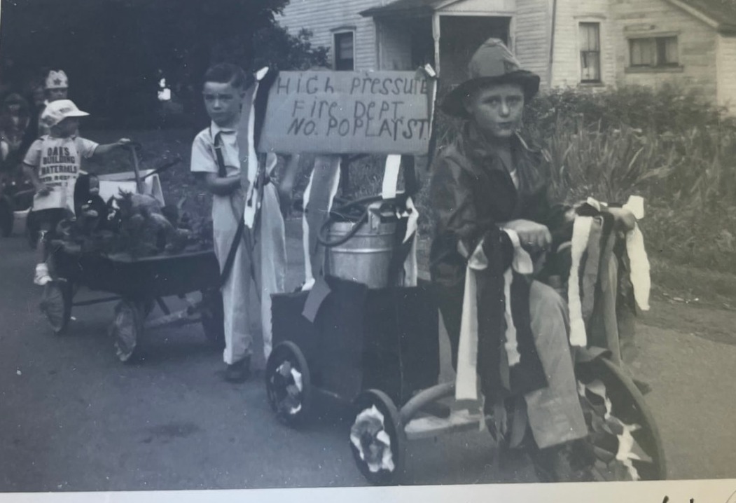 Kiddies Parade, Firemen's Field Days, North Rose, 1949 — Marvin Jensen leads with the "High Pressure Fire Dept., No. Poplar St." rig