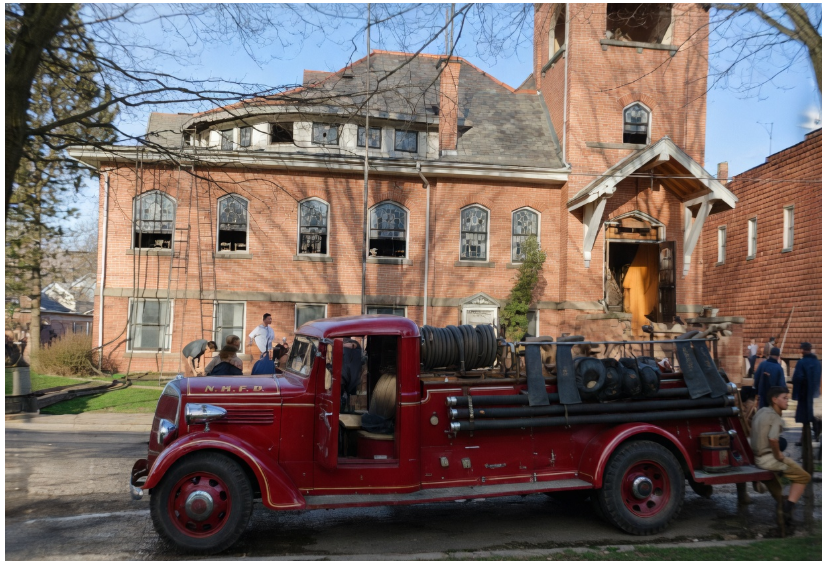 An early NRFD pumper outside the village church — archive photograph