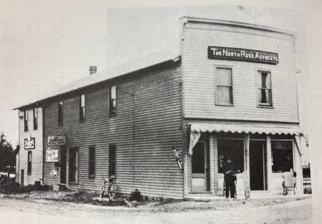 The Advocate building, referenced in the January 1917 article. Pictured is Charles Miner, father to Howard Miner, Advocate editor and fire department member.